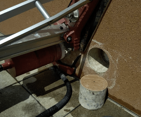 Carottage sur mur béton